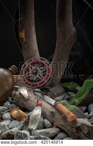 Still Life Of A Fisherman On Stones And Wood. Hobby And Passion. Vertical Frame.