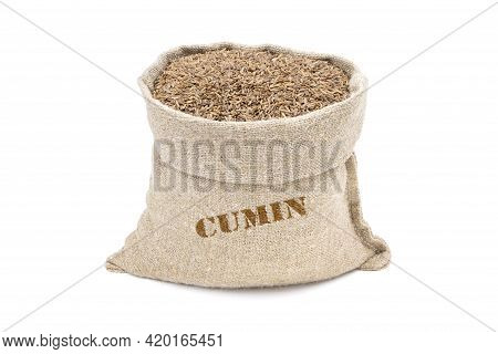Seeds Of Cumin In A Sack Isolated On A White Background. Caraway Seeds. Caraway In A Burlap Sack. He