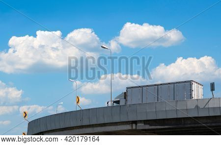 Truck Transport Logistics. Elevated Concrete Highway Road. Truck With Containers On The Road Deliver