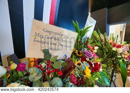 KUALA LUMPUR, MALAYSIA - JANUARY 18, 2020: close up shot of congratulation card with opening ceremony flowers at Sephora store in Fahrenheit 88 shopping mall in Kuala Lumpur.