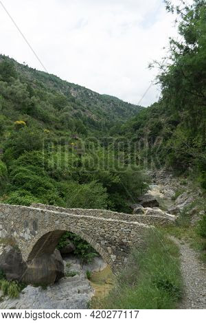 Stone Bridge In The Nervia Valley Near The Rio Barbaira Stream, Rocchetta Nervina, Liguria - Italy