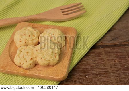 Malaysian Traditional Cookies Called As Kuih Bangkit Cheese On Wooden Plate Served During Eid Mubara