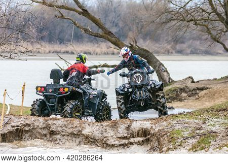 Afipsip, Russia - October 31, 2020: Sportsmen On Quad Bikes Finished Race At Mud Racing Contest. Atv
