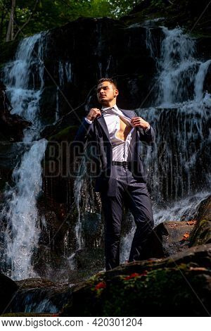 Profit Business Concept. Businessman Undressing At Waterfall Ready To Swim. Great Finance Waterfall.