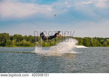 Man Skilfully Making Tricks On Wakeboard On Summr Day