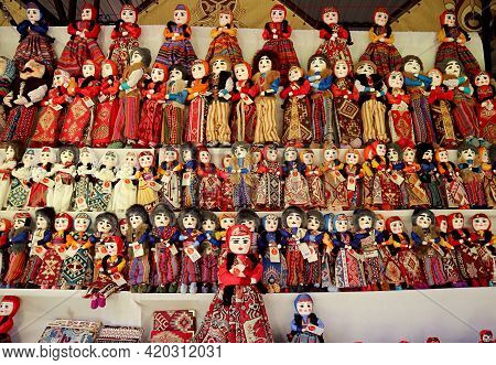 Rows Of Pretty Dolls In Armenian Traditional Costumes At Vernissage Market,yerevan, Armenia