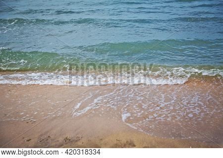 Clean And Relaxing Sea Wave Splashes Over Seashore. Coral Beach Of Tropical Paradise. Idyllic Seasca