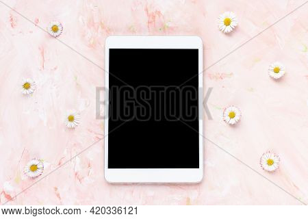 Digital Tablet And Spring Or Summer Flowers, Pastel Pink Background. Online Shopping, Studying, Sale