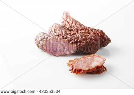Smoked Dried Sausage, Whole And Cut Into Slices, Isolated On A White Background. Traditional Polish 