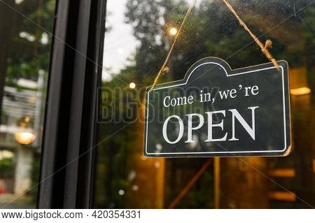 Come In, We Are Open - Open Sign Broad Hang On Entrance Door With Copy Space At Coffee Shop Or Resta