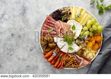 Charcuterie Assortment, Variety Of Cheeses And Salami, Prosciutto And Dried Fruits, Figs, Apricots, 