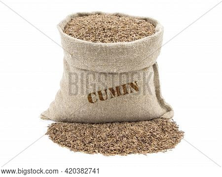 Seeds Of Cumin In A Sack Isolated On A White Background. Caraway Seeds. Caraway In A Burlap Sack. He