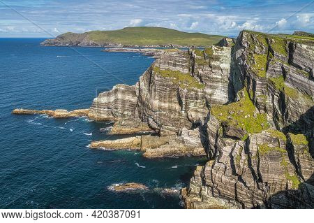 Rugged Coastline With Majestic Tall Kerry Cliffs And Turquoise Coloured Atlantic Ocean On A Sunny Su