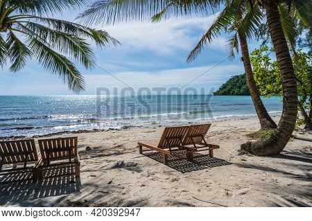 Wooden Chair Beside The Beach With Beautiful Idyllic Seascape View On Kohkood Island.koh Kood, Also 