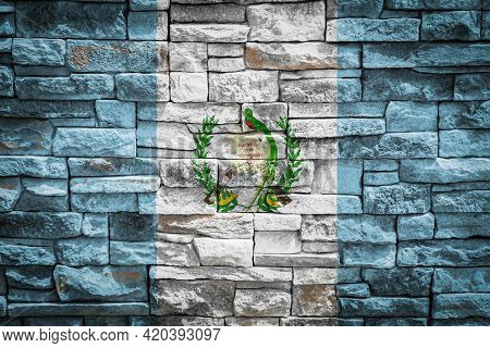 National Flag Of Guatemala On Stone  Wall Background.the Concept Of National Pride And Symbol Of The