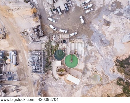 Quarry With Stone Sorting Conveyor Belts And An Open Pit Mine.
