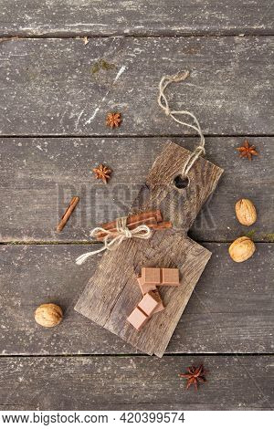 Pieces Of Chocolate, Cinnamon Sticks And Star Anise On A Wooden Board, Photo Rusticstyle
