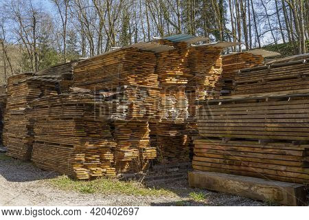 Lots Of Stacked Wooden Boards On A Lumber Yard In Sunny Ambiance