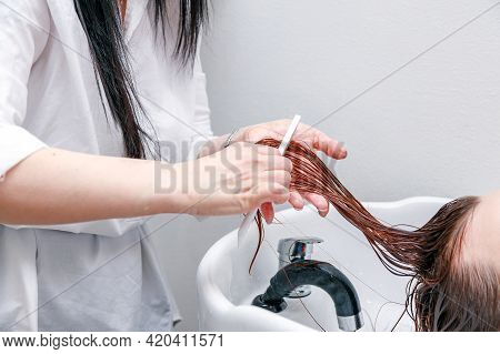 Stylist Washes The Girls Head. High Quality Photo