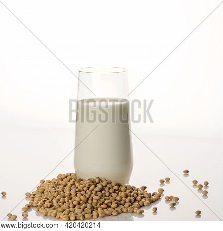 Vegan Soy Milk, Rice Milk, Oat Milk, Dairy-free Alternative Milk And Soybeans. White Background.