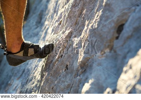 Climbing Shoes On The Climber\'s Foot Rest The Toe On The Rock. Extreme Sports, Mountain Tourism. Cl