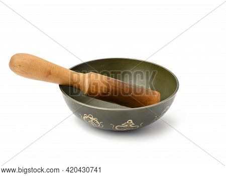 Copper Singing Bowl And Wooden Clapper On A White Background. Musical Instrument For Meditation, Rel