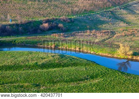 Gardens Meadows And Riverside Valley . Peaceful Scenery With Flowing River . Rustic Fields In The Sp