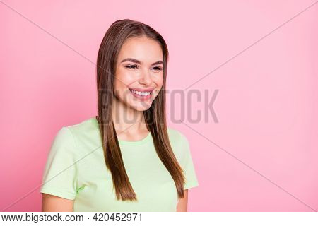 Photo Of Funny Charming Young Lady Wear Green T-shirt Smiling Looking Empty Space Isolated Pastel Pi