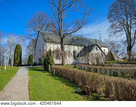 Barkarby, Sweden - April 2, 2021: Outdoor Front View Of The Christian Church Järfälla Kyrka With Sur