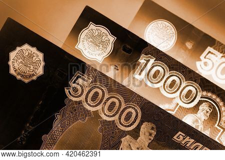Russian Banknotes 5000, 1000 And 500 Rubles Close-up. Dark Dramatic Black And Brown Illustration Abo