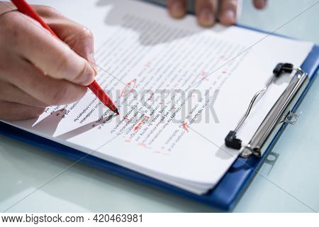 Editing Essay Content On Paper. Proofreader Marking Mistake