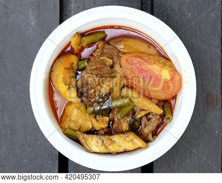 Flatlay Picture Of Beef Dalca Served During Eid Mubarak. Dalca Is A Stewed Vegetable Curry With Lent