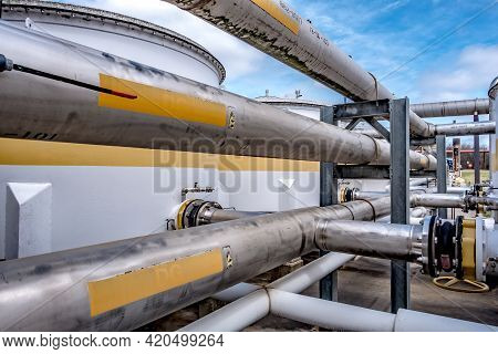 Pipes, Tubes, Machinery And Steam Turbine At A Power Plant