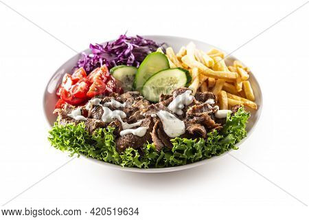 Savory Turkish Veal Kebab Served With Fresh Vegetables, Letuce, French Fires And Lovely And Deliciou