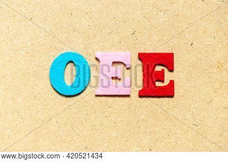 Color Cloth Alphabet Letter In Word Oee (abbreviation Of Overall Equipment Effectiveness) On Wood Ba