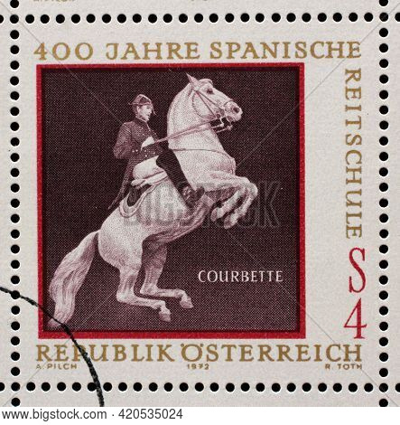 ZAGREB, CROATIA - SEPTEMBER 13, 2014: Stamp issued in the Austrian shows Equestrianism and horse riding, Spanish Horse Riding School in Vienna - Courbette, circa 1972.