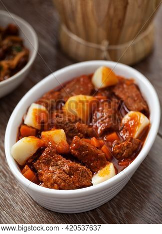 Hot Stew With Mushrooms And Potatoes On A Plate.