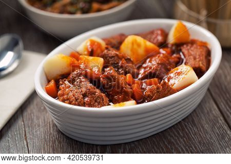 Hot Stew With Mushrooms And Potatoes On A Plate.