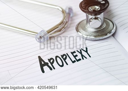 Apoplexy. Text On A Medical Card Next To A Pen Stethoscope.