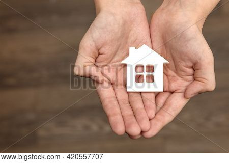 Orphanage, Children In The Orphanage. The Child Is Holding A Small House-shaped Figurine, Close-up. 