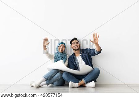 Loving Muslim Couple Thinking About Design In New House
