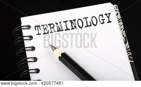 Terminilogy Written Text In Small Notebook On Black Background