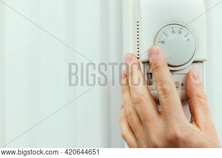 Human Hand On The Air Conditioner Temperature Controller. Service For The Installation And Configura