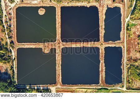 Aerial View Of Ponds For Collect Stormwater. Rainwater Retention Basins, Bird Eye View. Artifical Po