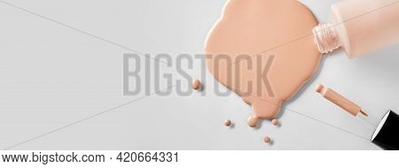 Banner With Mockup Glass Bottle Of Correction Cosmetic Product With Pipette. Spilled Liquid Foundati