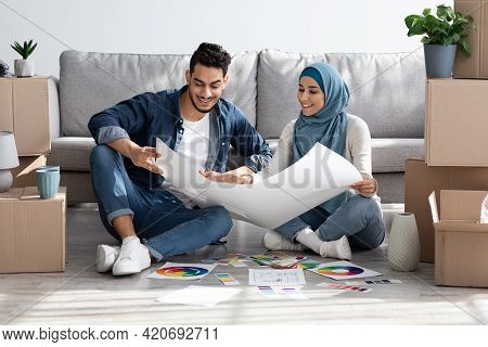 Creative Muslim Family Working On Design For New House