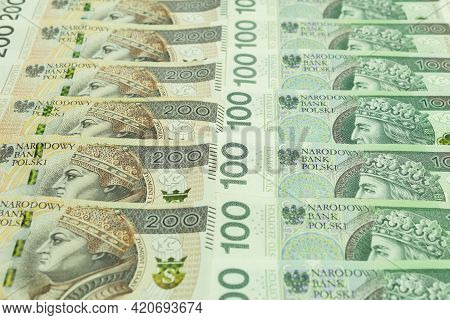 Polish Money, Pln 100 And 200 Pln. Layout Of Large Bills Of Money. Photo Of Polish Banknotes, Zloty 