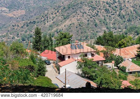 Roofs Of Kykkos Monastery Between Green Trees On A Clear Sunny Day