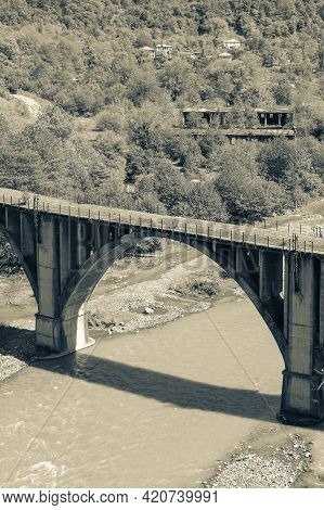 Abkhazia. Abandoned Railway Bridge Over The River Alxga. Attraction Of The Abandoned City Of Tkuarch