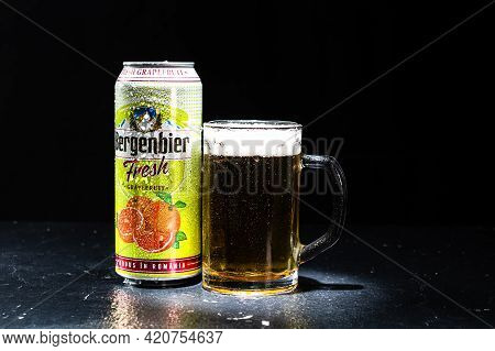 Can Of Bergenbier Beer And Beer Glass On Dark Background. Illustrative Editorial Photo Shot In Bucha